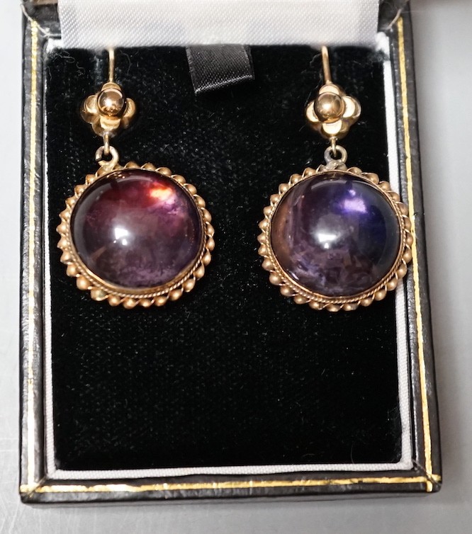 A pair of yellow metal mounted foil backed cabochon amethyst paste set drop earrings, overall 38mm, gross weight 11.7 rams.